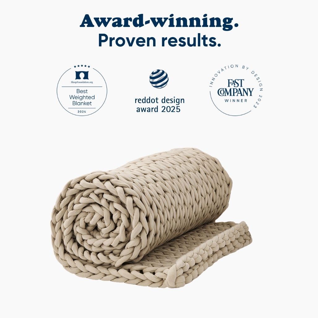 Rolled blanket with award badges on a white background