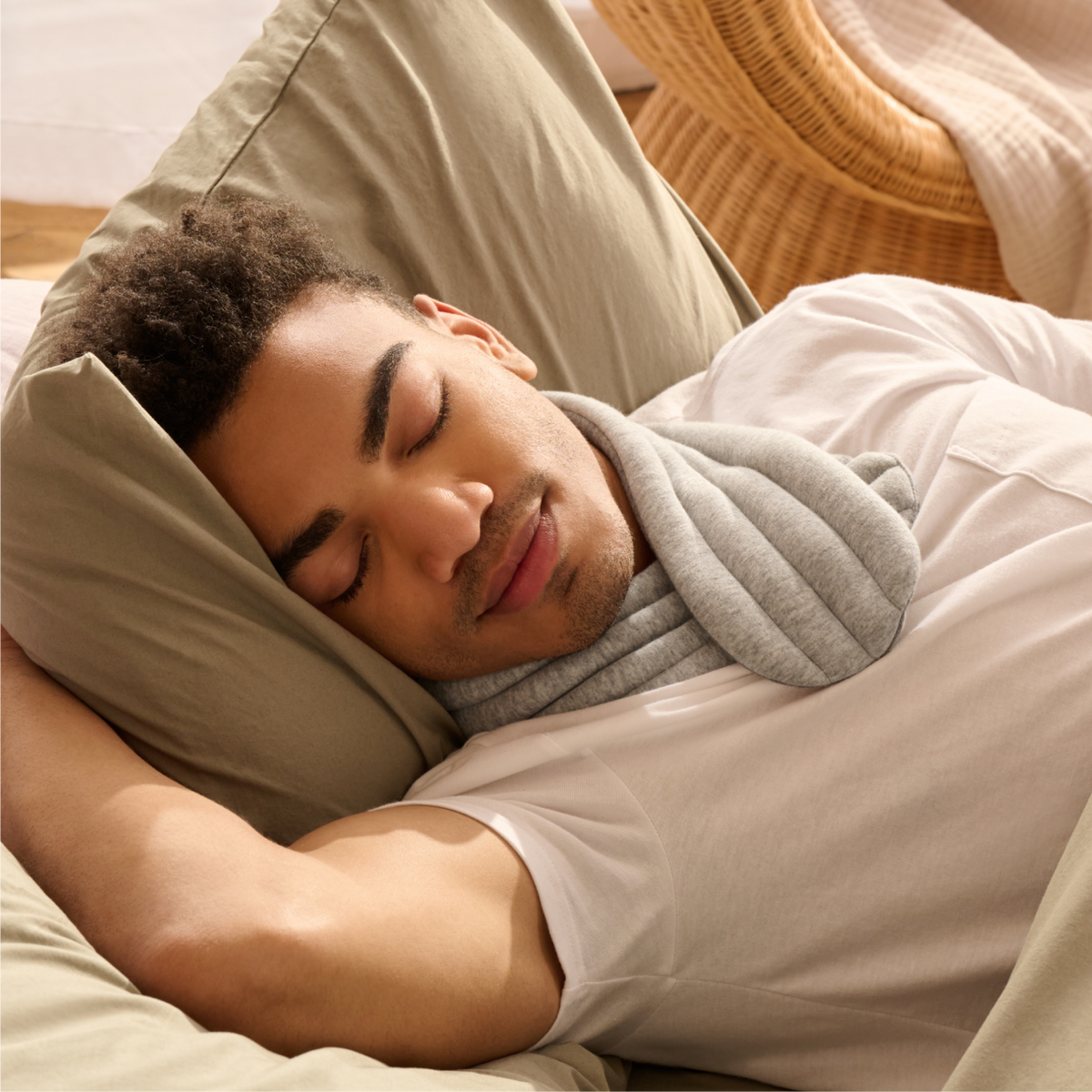 a person sleeping with AURTRS neck wrap