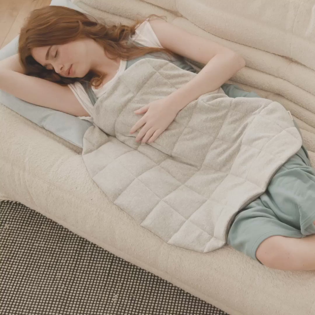 girl with warmable weighted lap pad 