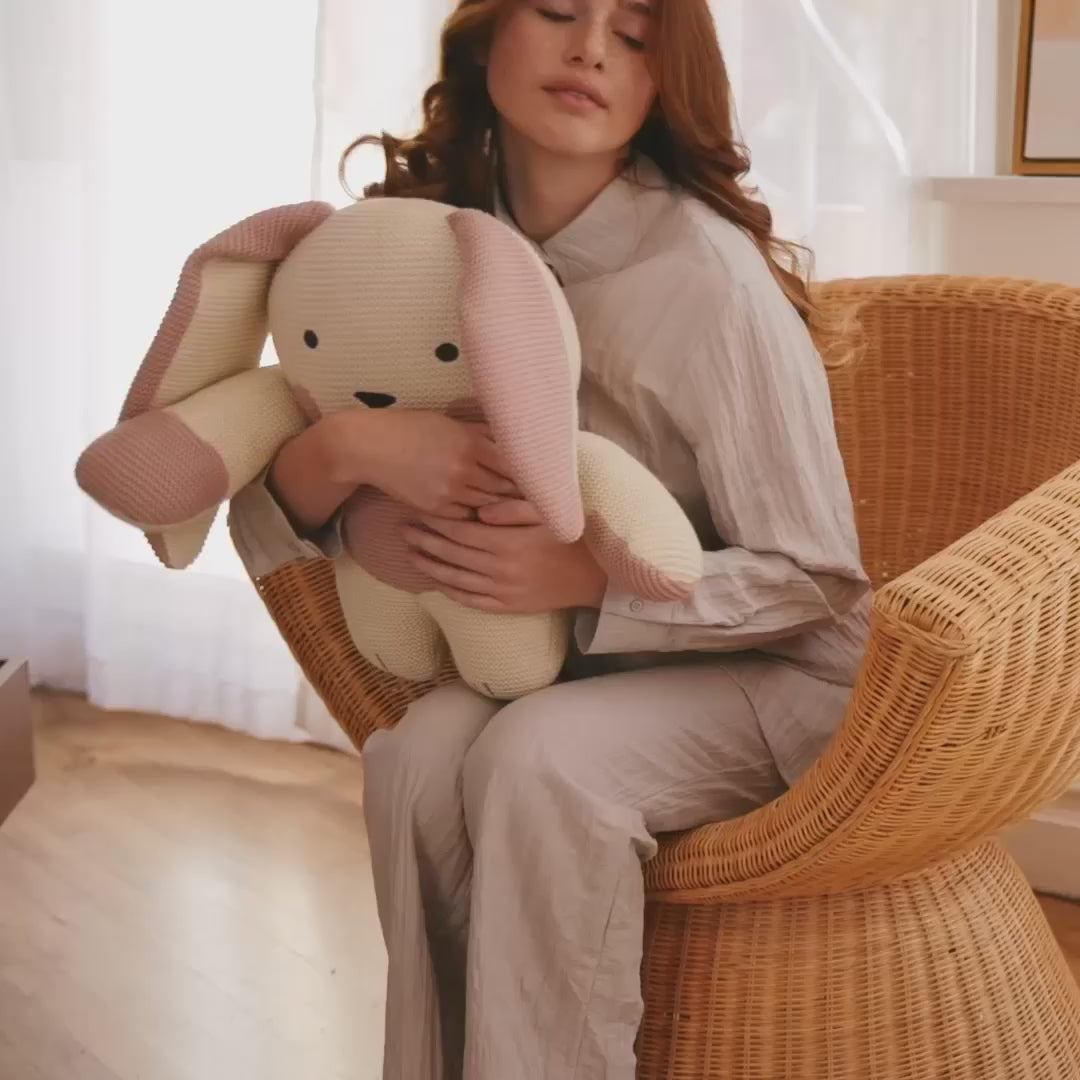 women holding Remi Rabbit 