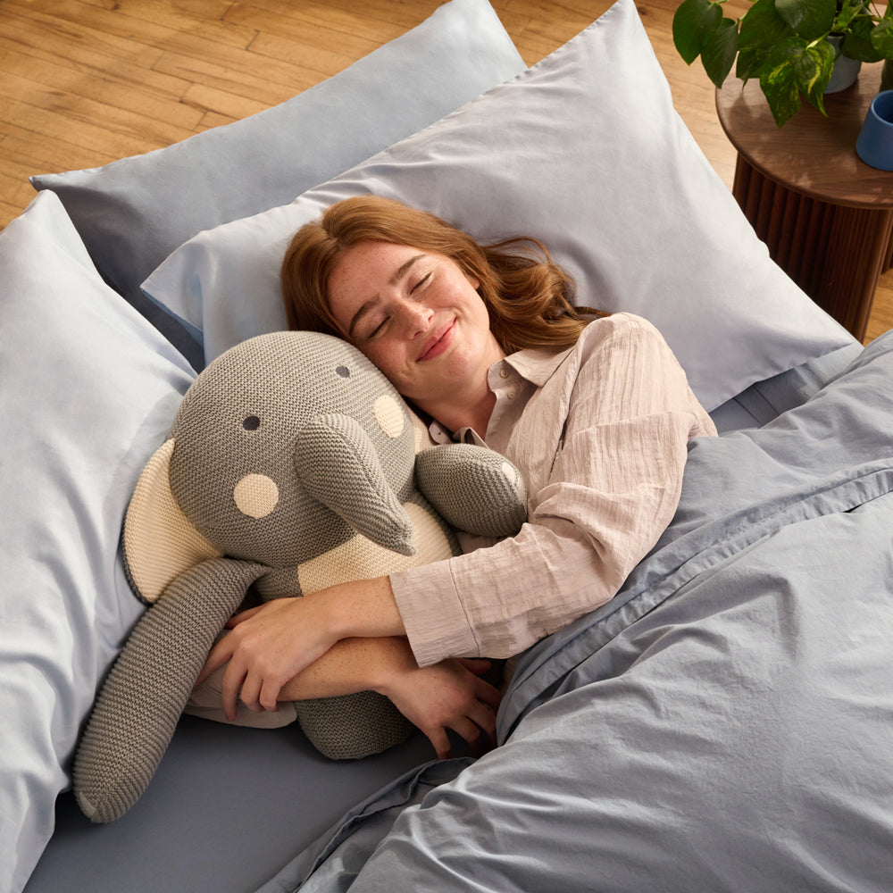 women resting with AURTRS Elli plushies